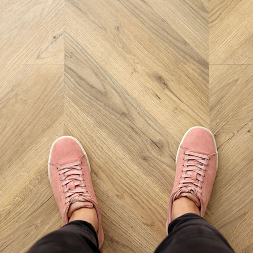 Herringbone patterned luxury vinyl flooring