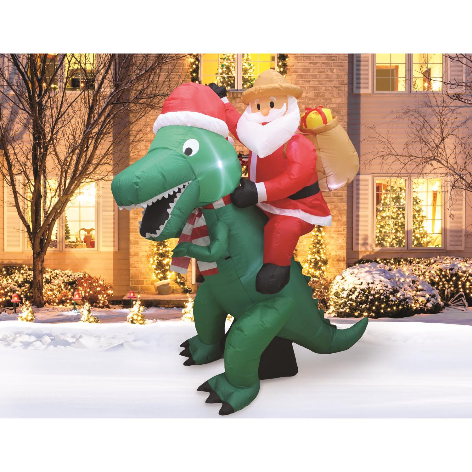 A Holiday Company Jurassic Santa LED Dinosaur with Santa 6 ft. Inflatable